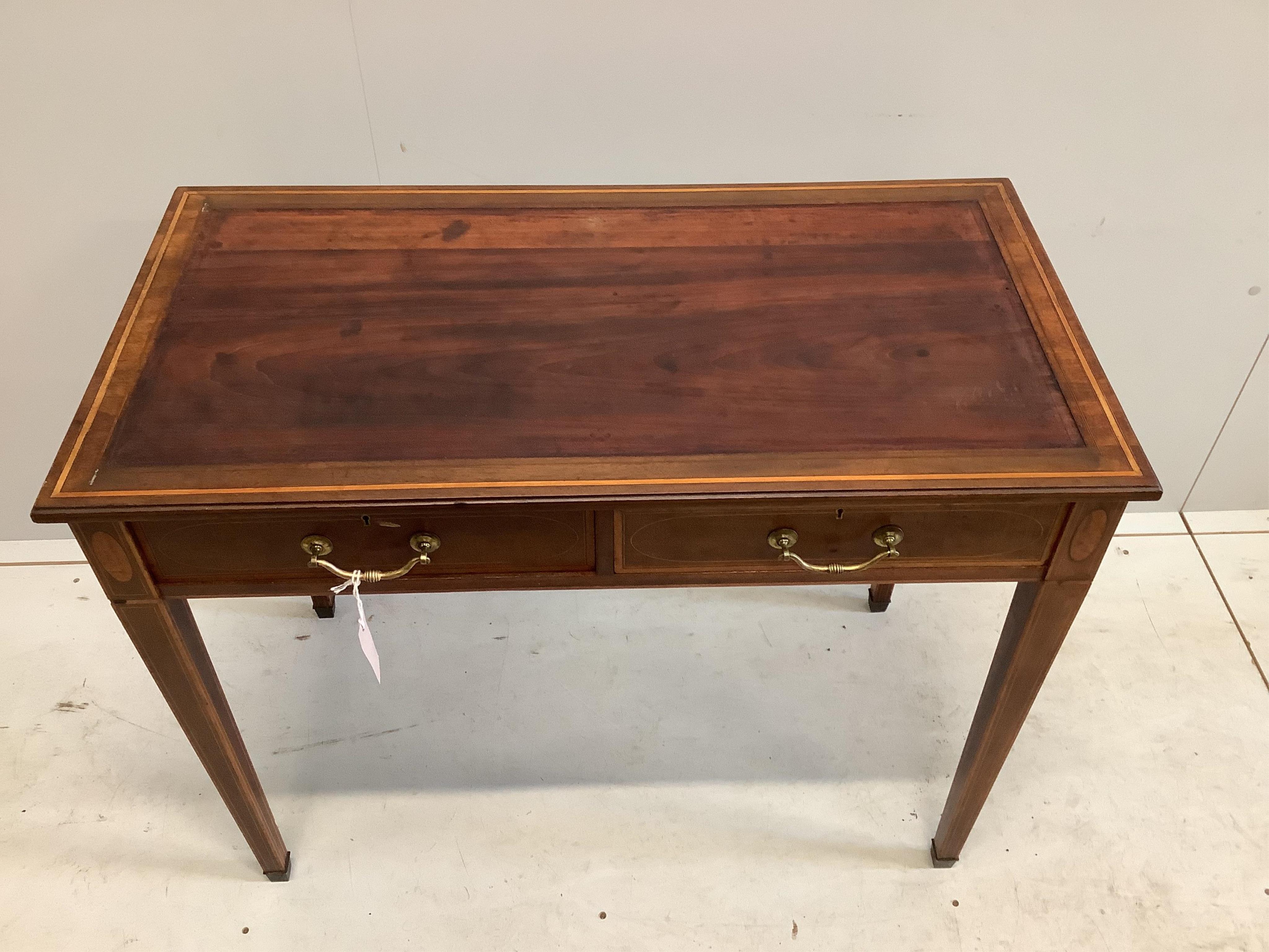 An Edwardian Edwards and Roberts satinwood banded mahogany writing table, width 91cm, depth 47cm, height 72cm. Condition - fair, lacks leather top